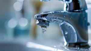 Leaky faucet with water droplets illustrating common plumbing issue, relevant to DIY repair tips for homeowners.